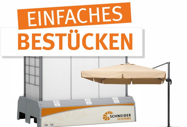 Set-up Schneider canilver parasol in front of a sales display showcasing cantilever parasols and other boxed products in a clear and customer-friendly arrangement.