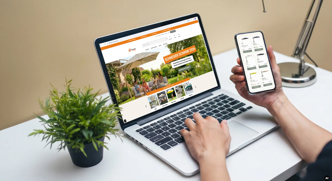 Nicht erkennbare Person sitzt an einem Tisch mit Kaffeetasse, surft auf Laptop und Smartphone auf der Schneider Schirme Website – Jetzt E-Commerce Partner werden.  KI-generiertes BIld.