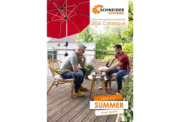 Cover of the Schneider Schirme Catalog 2026. The Schneider logo, title and subtitle are visible at the top right and the phrase ‘Make your summer even better’ is at the bottom right. The image shows two men playing chess at a small table on a balcony under the red Venedig parasol.